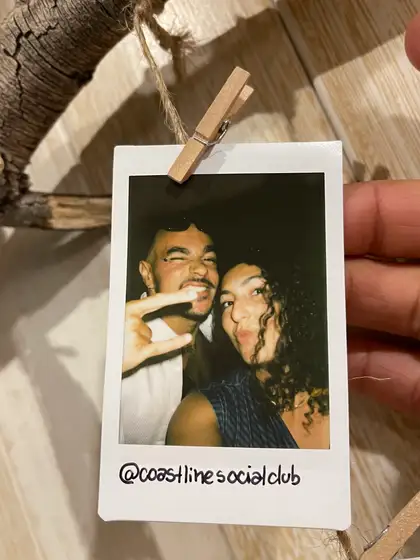 A polaroid from the stand, pegged on the line.