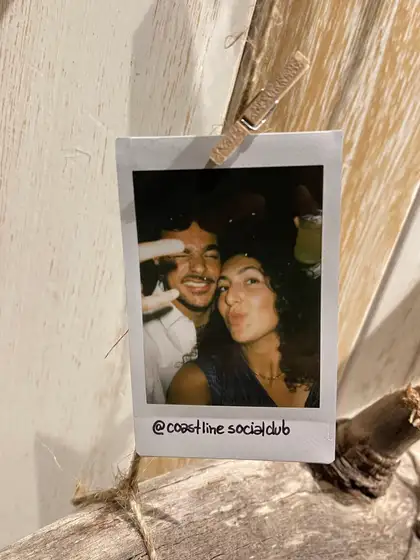 A polaroid from the stand, pegged on the line.