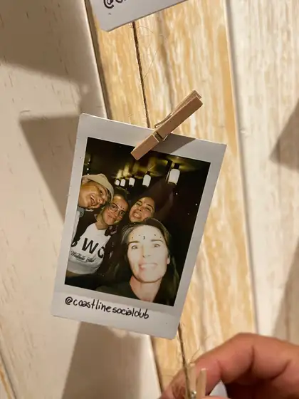 A polaroid from the stand, pegged on the line.