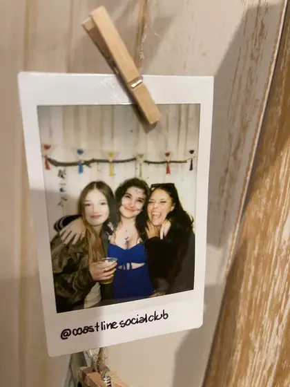 A polaroid from the stand, pegged on the line.