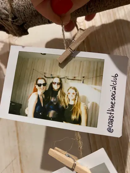 A polaroid from the stand, pegged on the line.