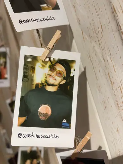 A polaroid from the stand, pegged on the line.