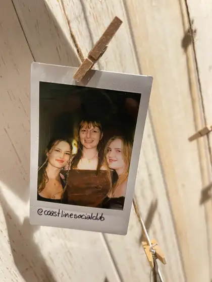 A polaroid from the stand, pegged on the line.