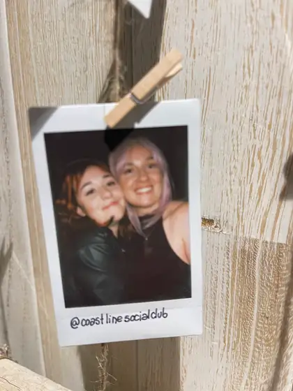 A polaroid from the stand, pegged on the line.