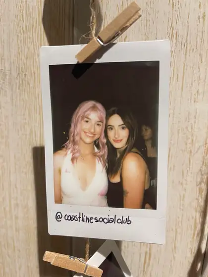 A polaroid from the stand, pegged on the line.