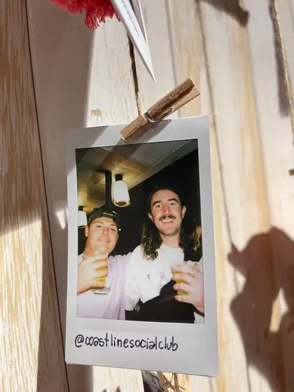 A polaroid from the stand, pegged on the line.