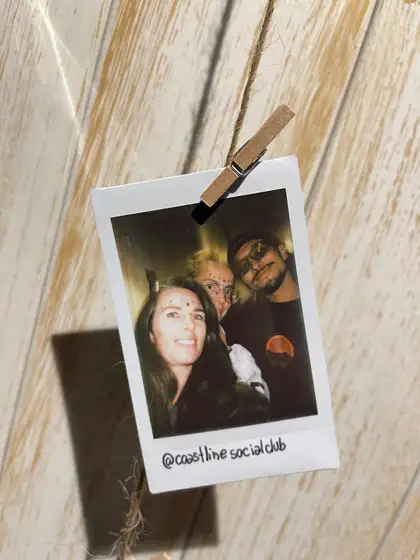 A polaroid from the stand, pegged on the line.